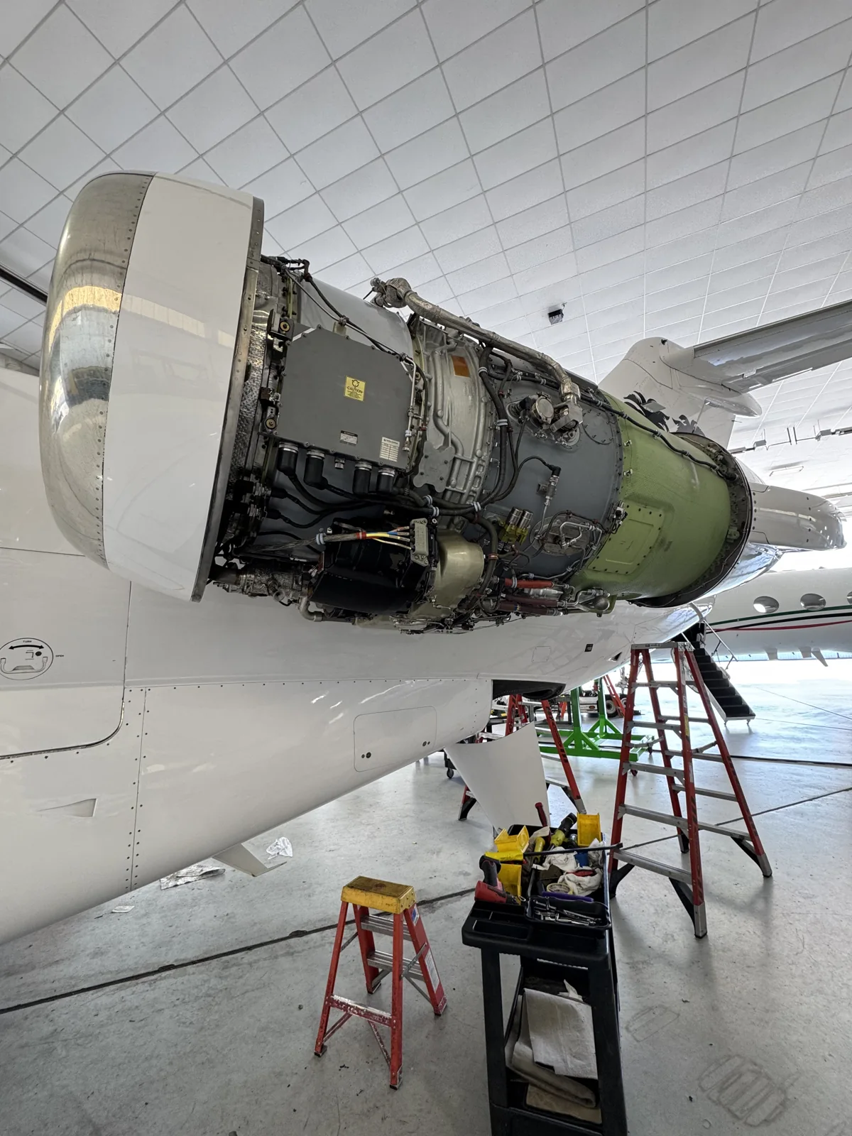 Engine with cowling removed for access in the hangar.